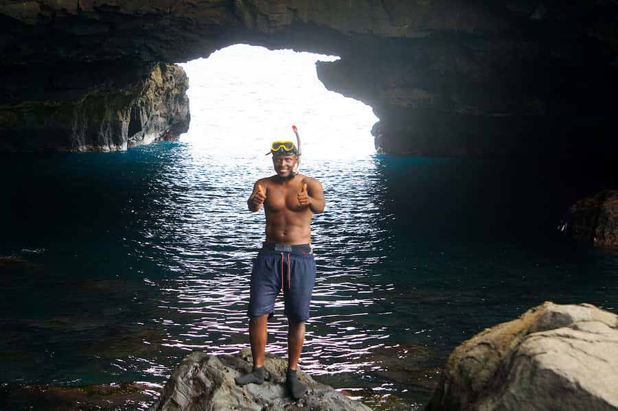 From Praia: Boat Trip, Snorkeling, Cave & BBQ on the Beach - Black sand, grilled fish, and a simple beach lunch