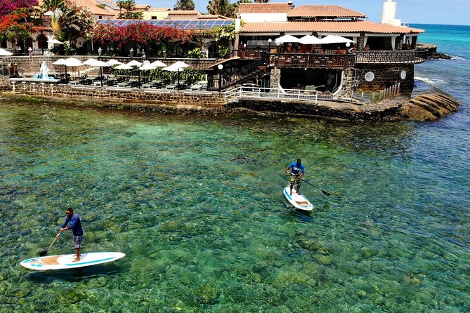 Stand Up Paddle Tour in Santa Maria Bay - Passing the pier and watching the fishing boats
